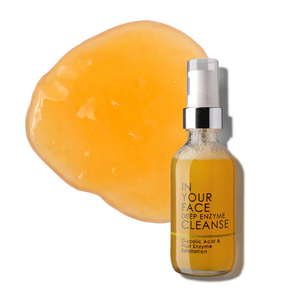 Bottle of 'In Your Face Deep Enzyme Cleanse' with a yellow soap bar on a white background