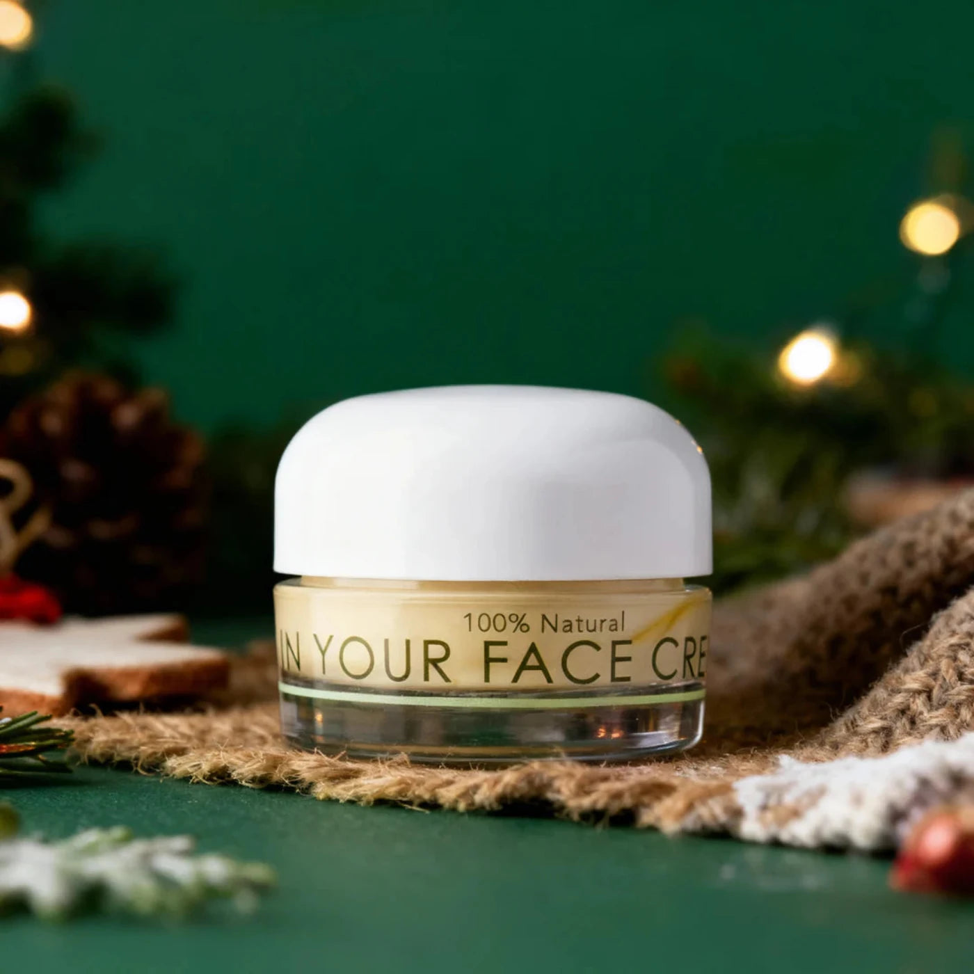 Jar of 'On Your Face Cream' with a festive background
