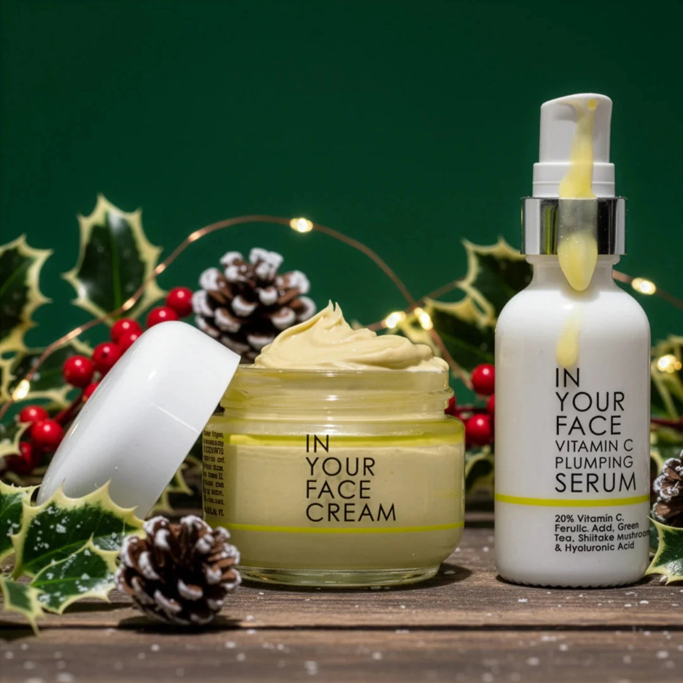 Skincare products including a jar of cream and a serum bottle on a wooden surface with decorative elements.