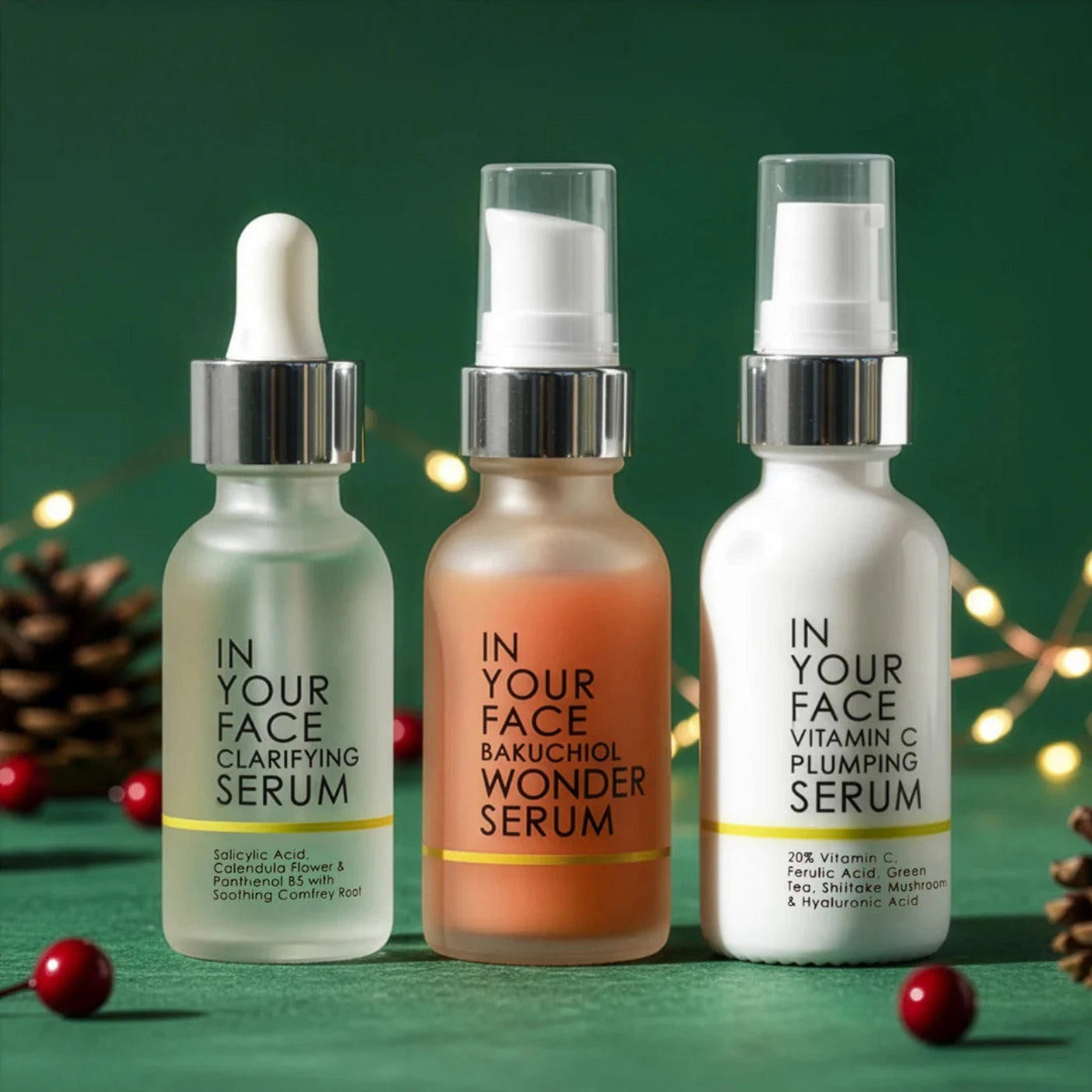 Three skincare serum bottles with labels on a green background