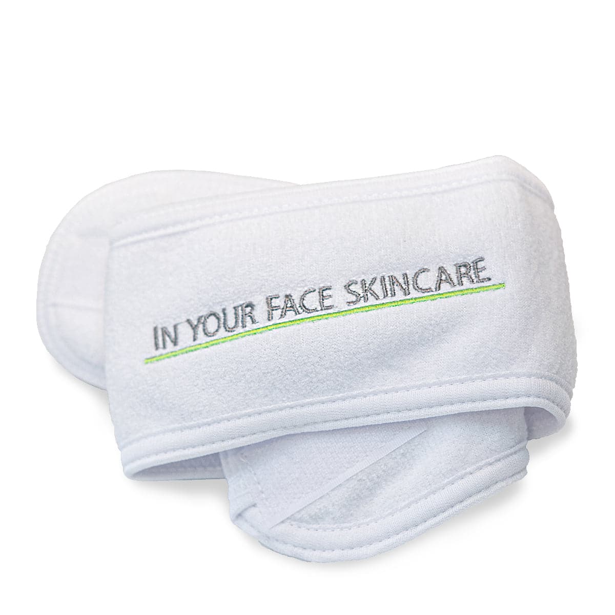 White face mask with 'In Your Face Skincare' text on a white background