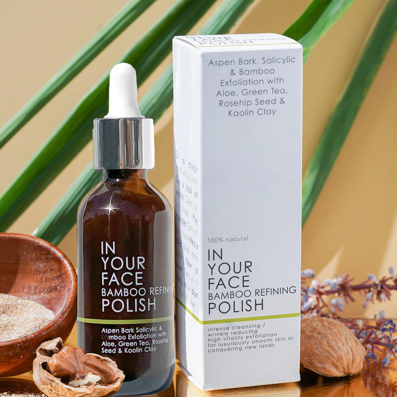Bottle and box of 'IN YOUR FACE BAMBOO REFINING POLISH' with natural ingredients on a wooden surface.