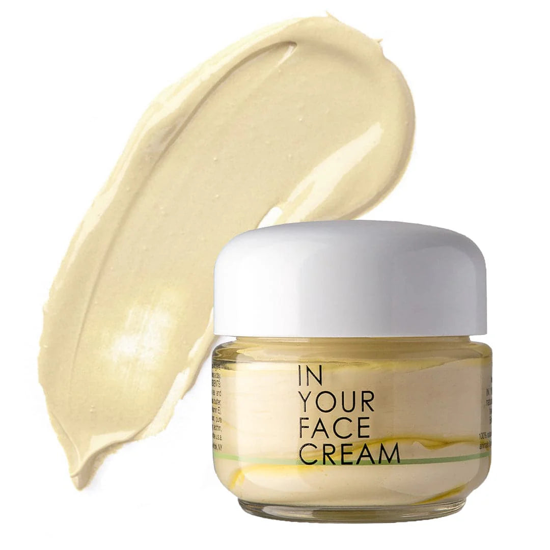Jar of 'In Your Face Cream' with a swatch of cream on a white background
