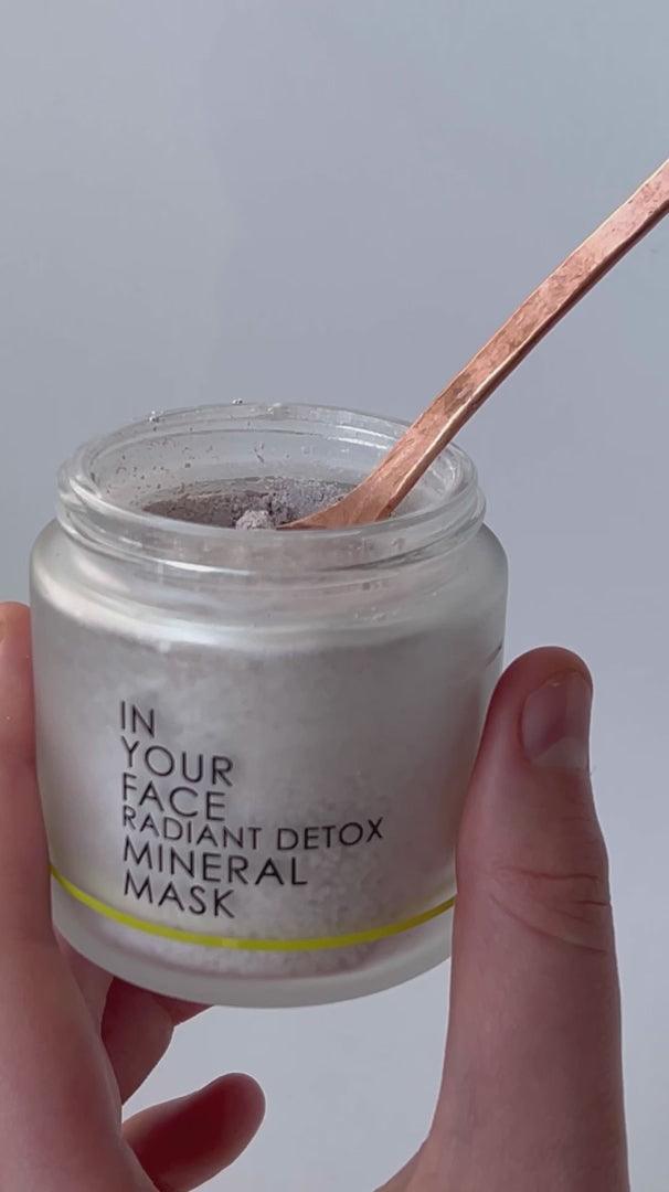 Video showcasing the In Your Face Radiant Detox Mineral Mask, highlighting its vibrant pink hue, powder-to-paste transformation, and luxurious application process for detoxified, radiant skin.