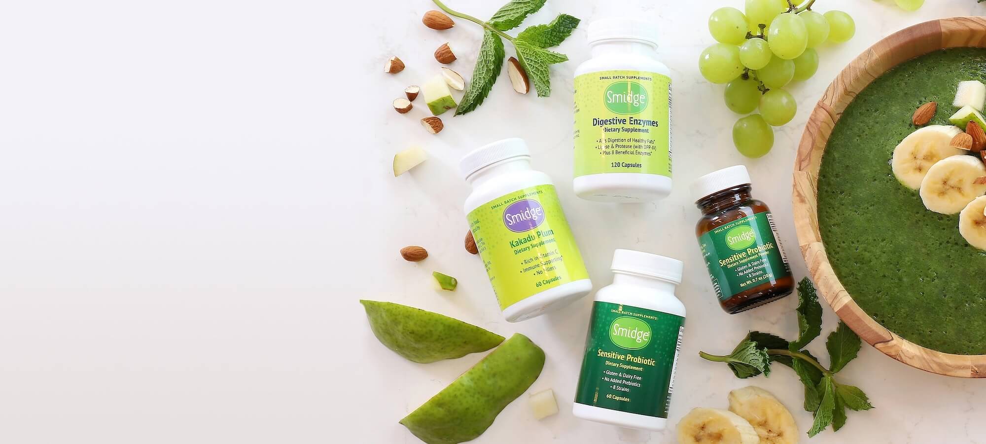 Smidge natural health supplements showcased in an outdoor setting with bottles of vitamins and probiotics, promoting clean ingredients and holistic wellness.