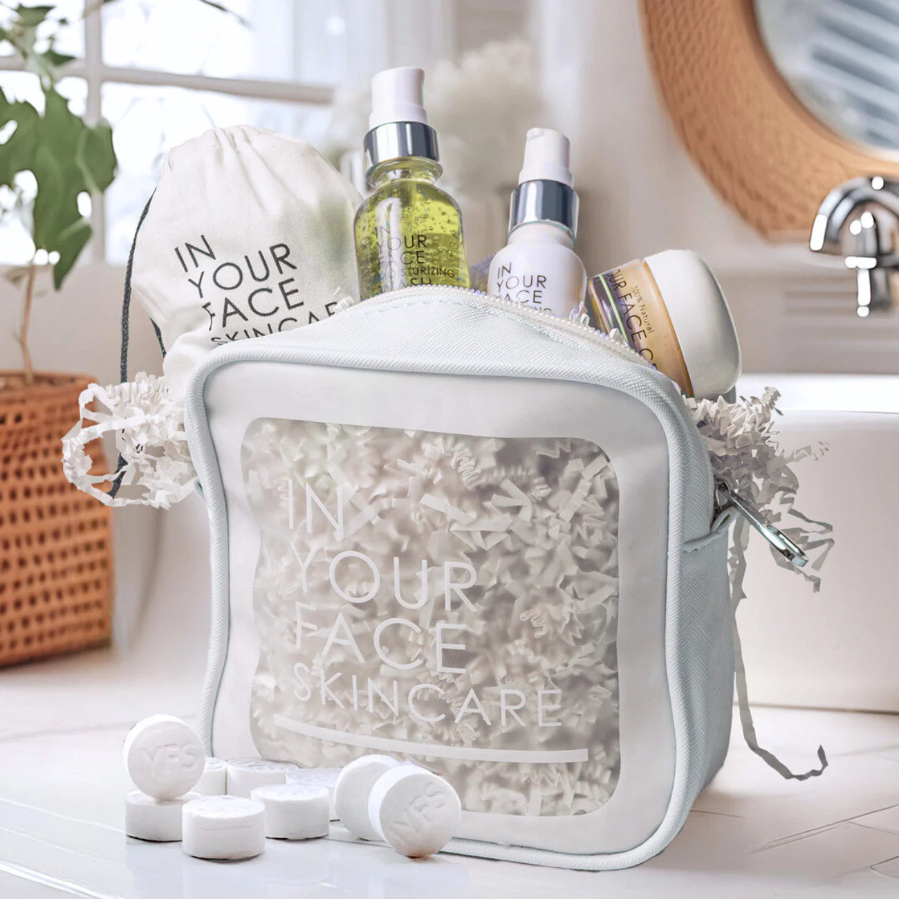 Skincare products from 'In Your Face Skincare' on a bathroom counter.
