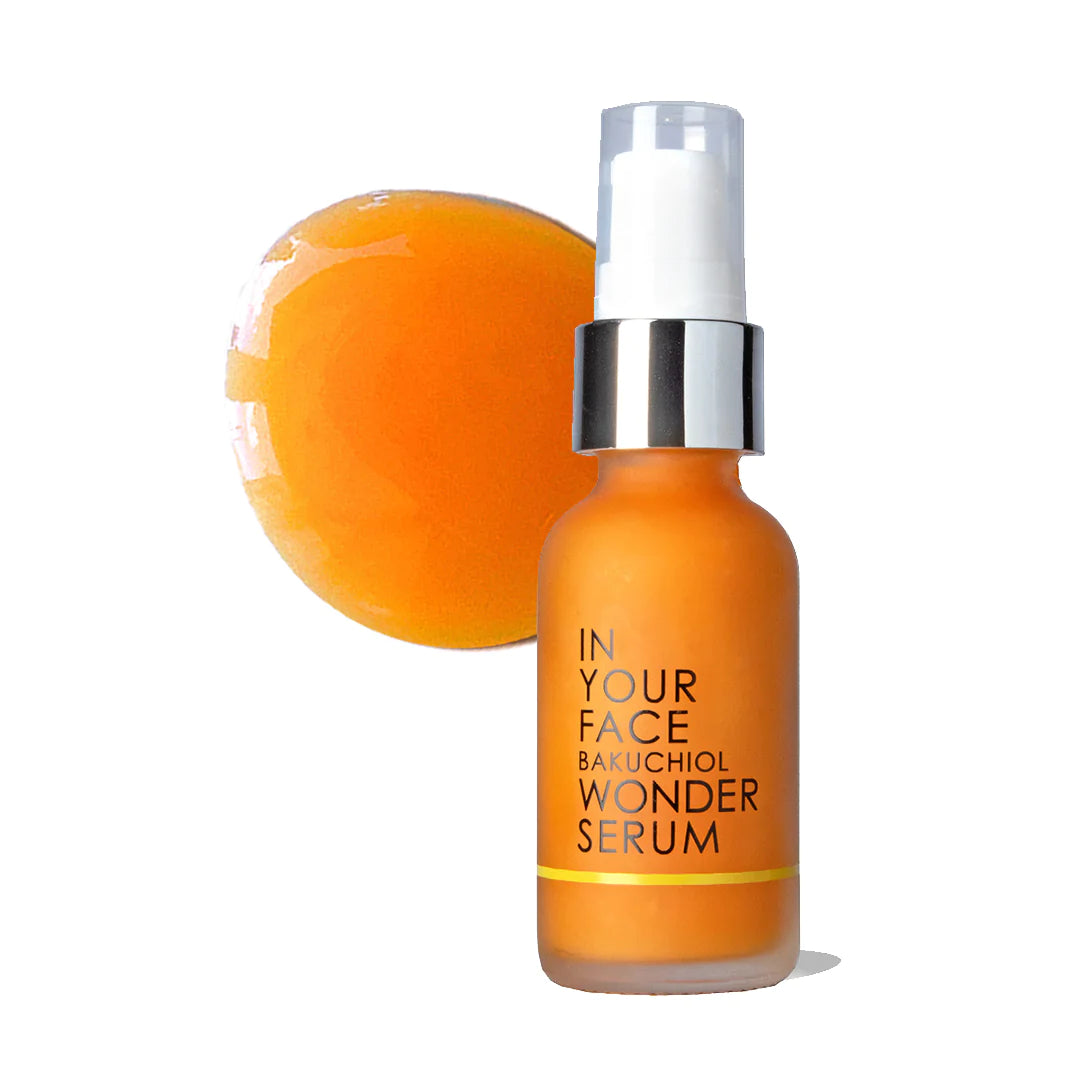 In Your Face Bakuchiol Wonder Serum in an orange glass bottle, formulated to promote youthful, radiant skin with natural botanicals.