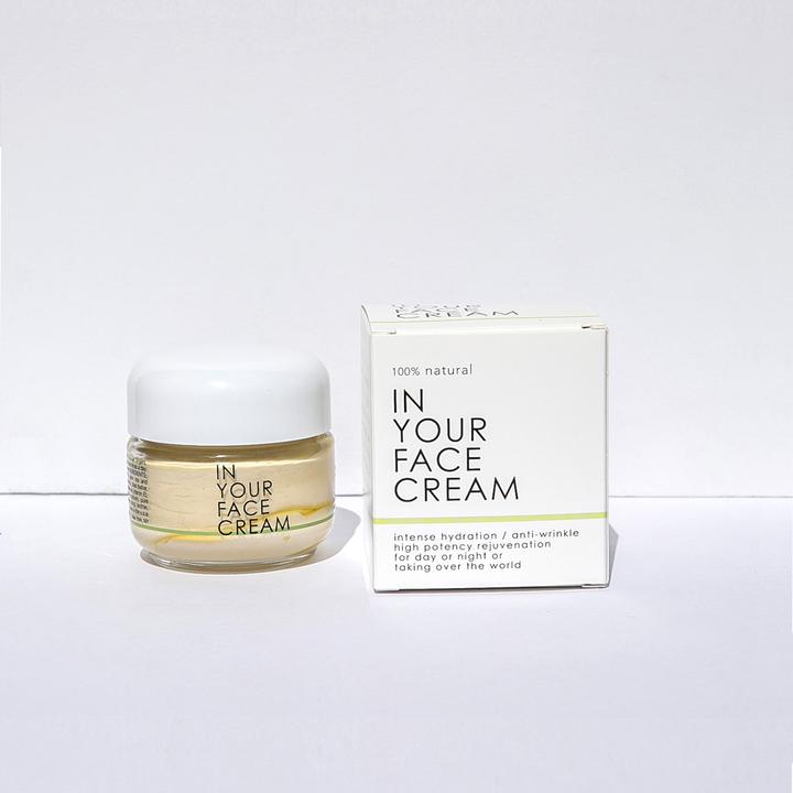 In Your Face Cream in a glass jar, a luxurious moisturizer that hydrates and nourishes the skin with natural extracts.