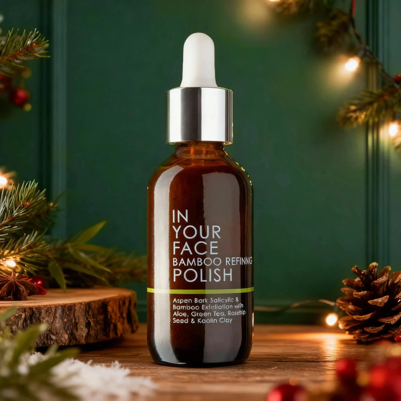 Bottle of 'In Your Face' bamboo refining polish with festive background
