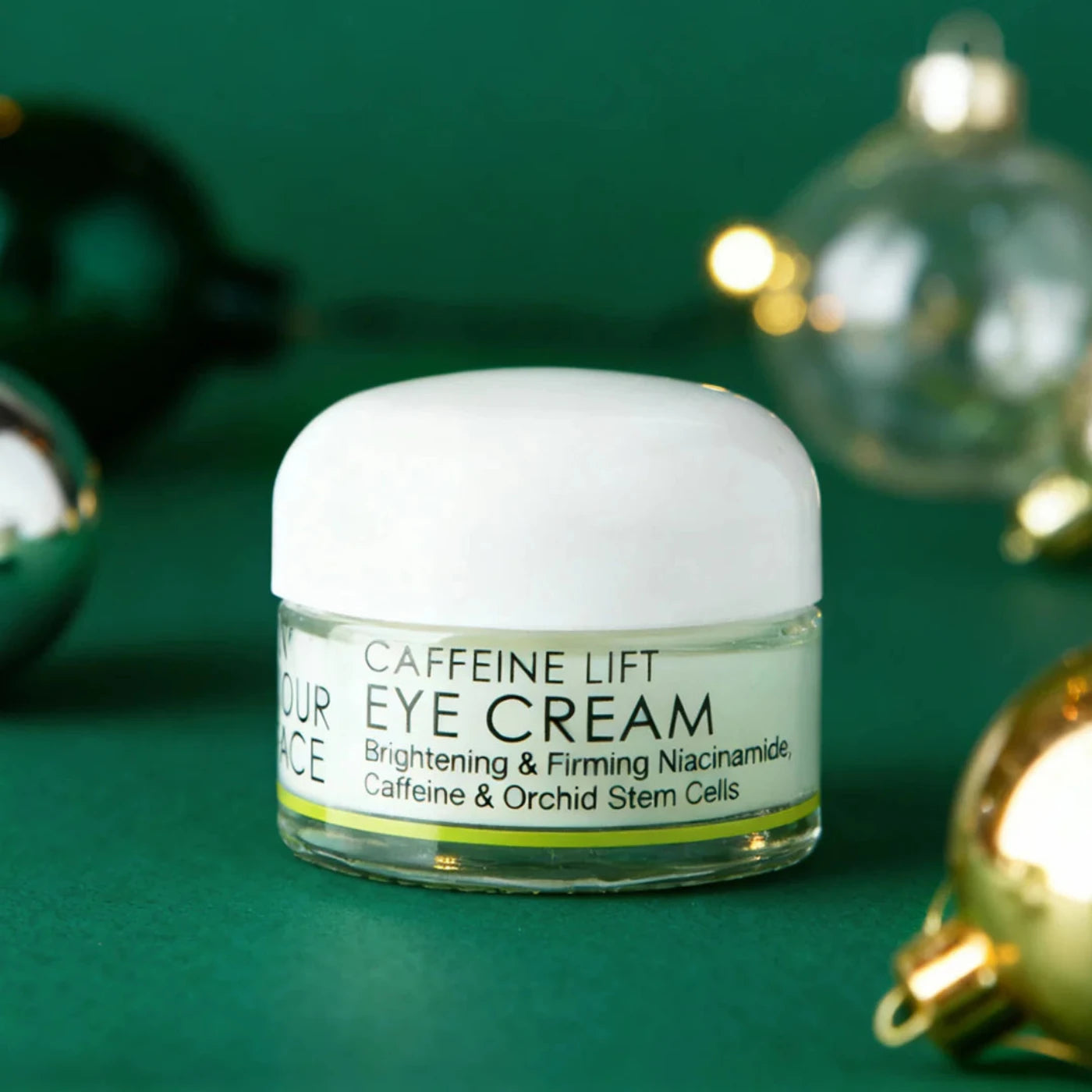 Jar or Caffeine Lift Eye Cream in Christmas decor background