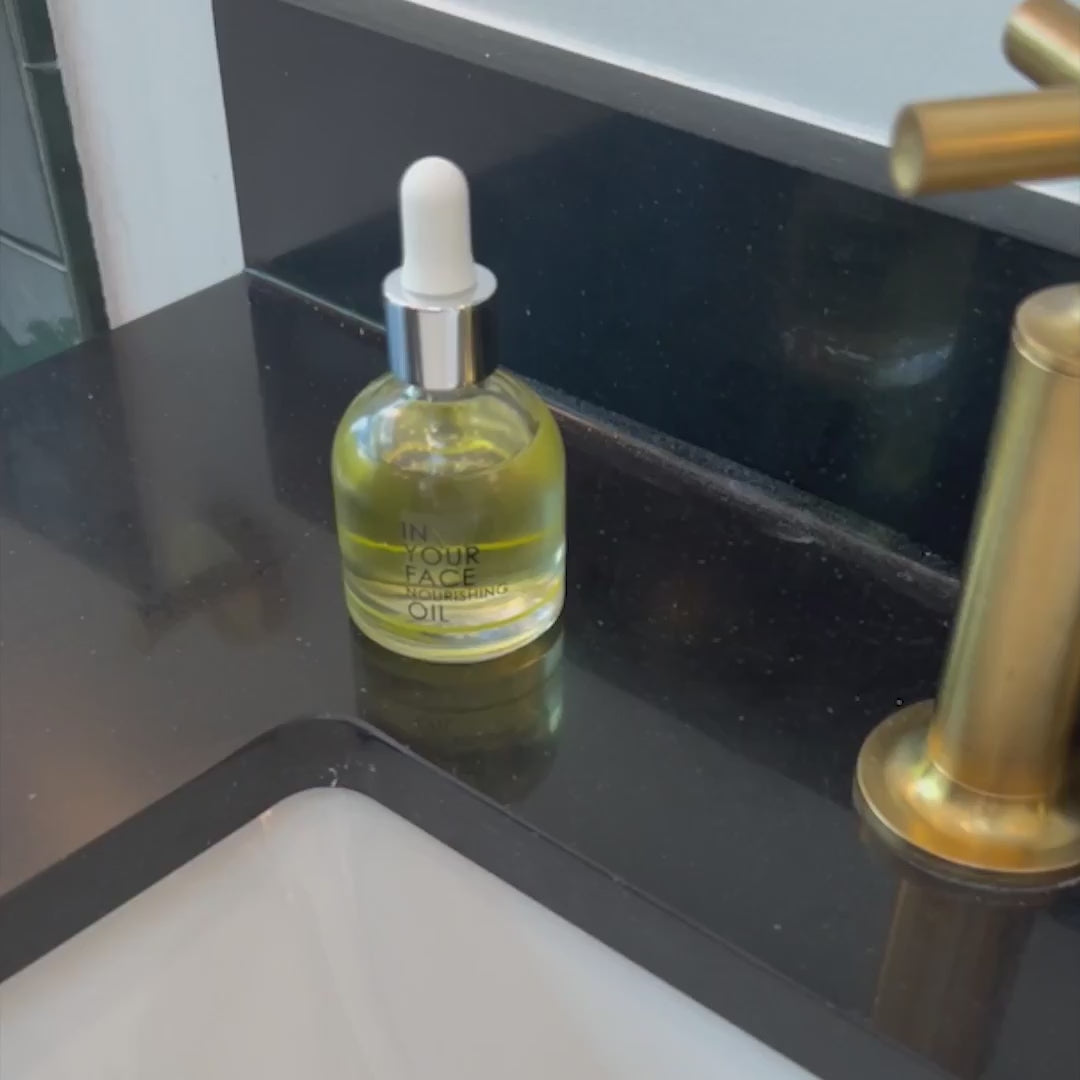 Demonstration of In Your Face Nourishing Oil – lightweight facial oil applied for hydration, glow, and smoother skin