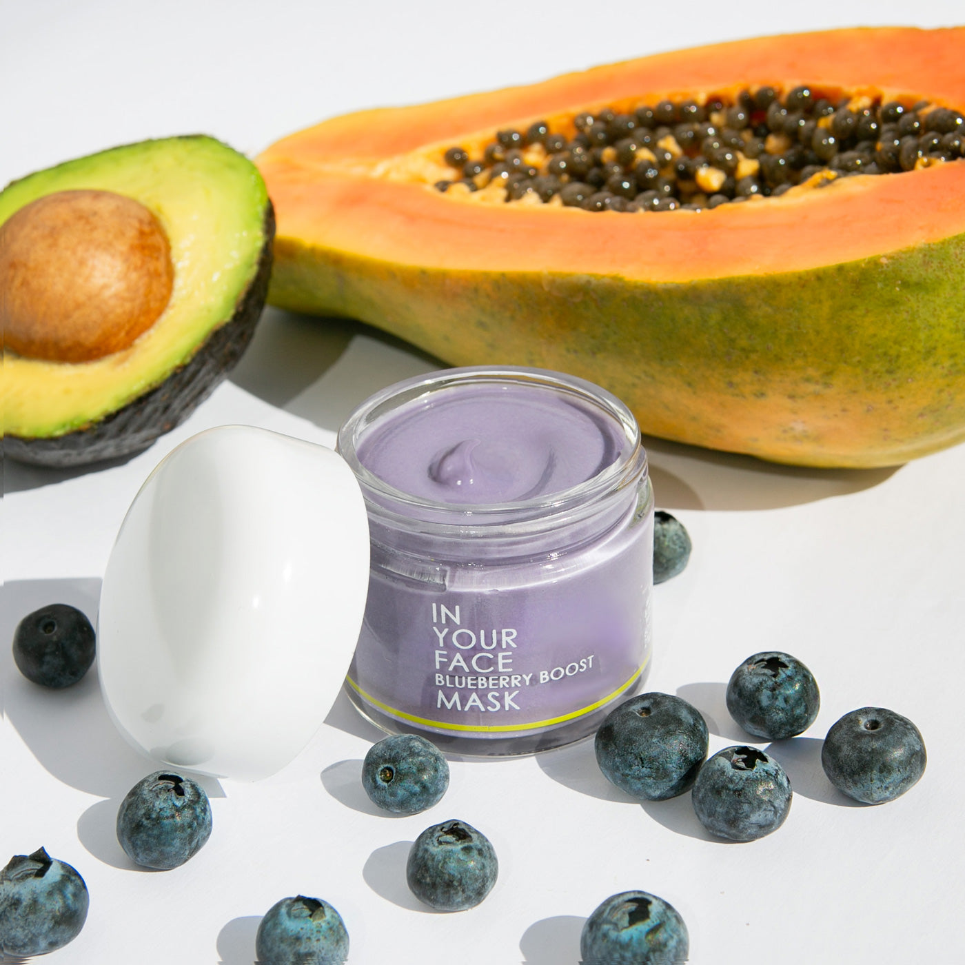 In Your Face Blueberry Boost Mask in a glass jar, enriched with antioxidant-rich blueberries for revitalizing and hydrating the skin.