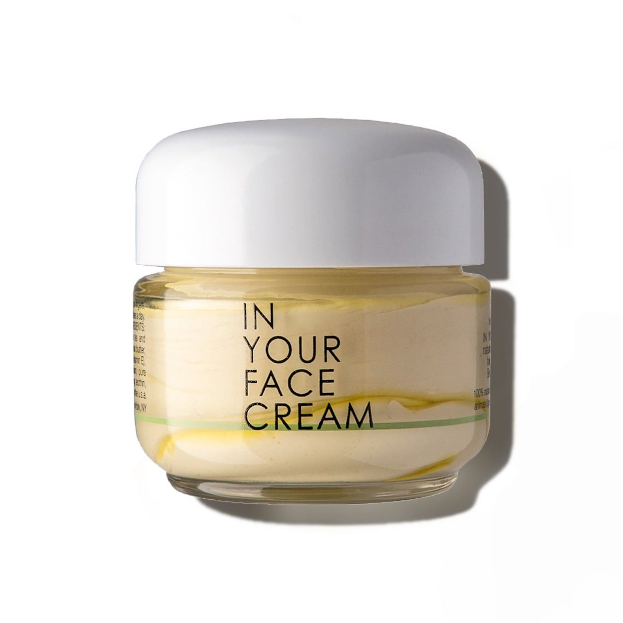 In Your Face Cream in a glass jar, a luxurious moisturizer that hydrates and nourishes the skin with natural extracts.