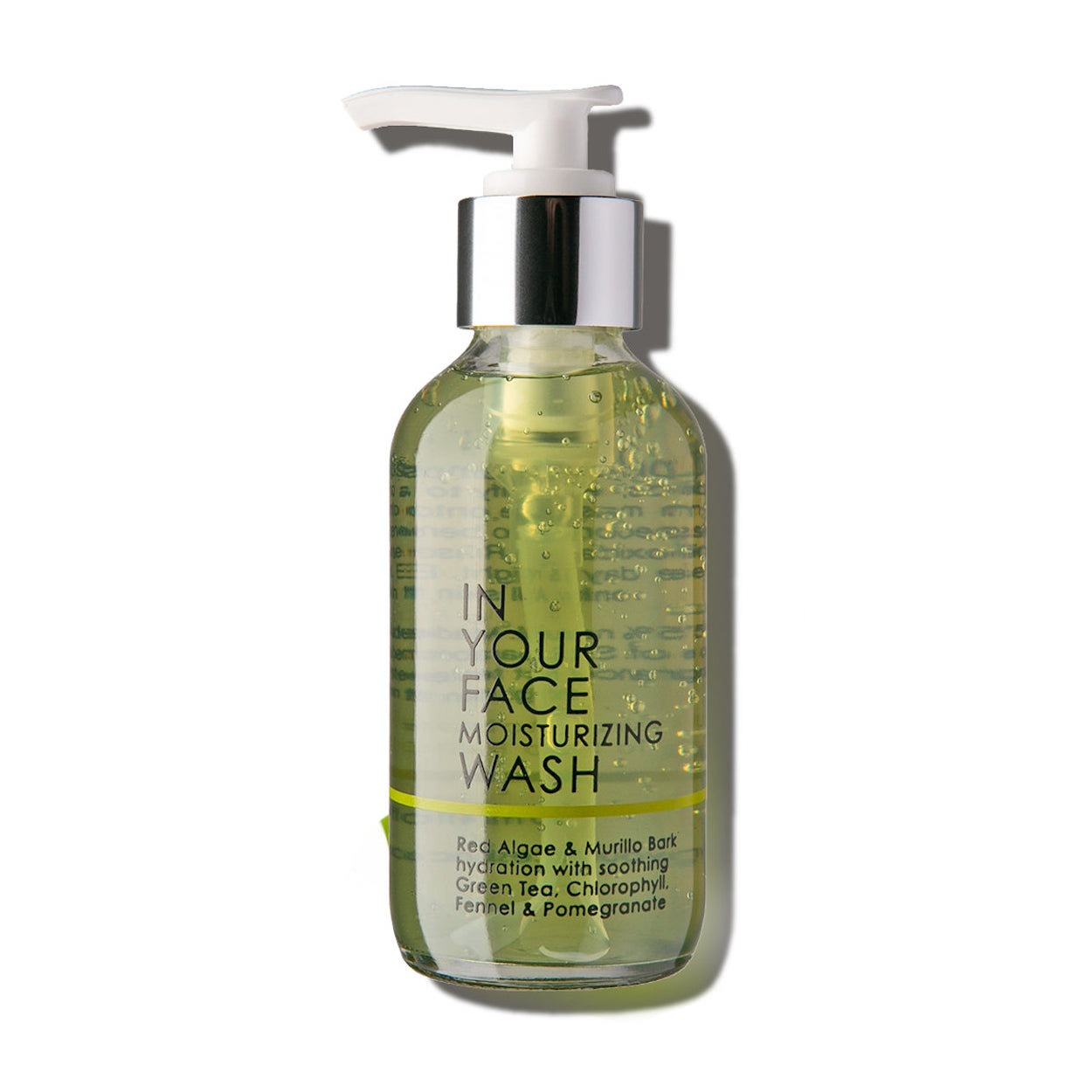 In Your Face Moisturizing Wash in a clear bottle with a pump, offering hydration with natural ingredients for a soft and clean skin feel.