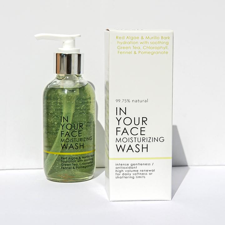 In Your Face Moisturizing Wash in a clear bottle with a pump, offering hydration with natural ingredients for a soft and clean skin feel.